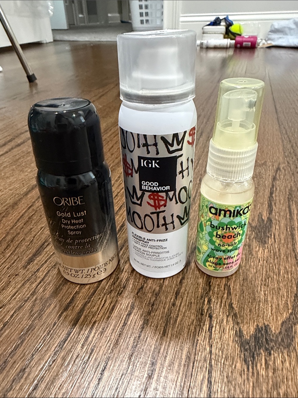 3 travel products-IGK Good Behavior, Oribe dry heat protection, Amika wave spray